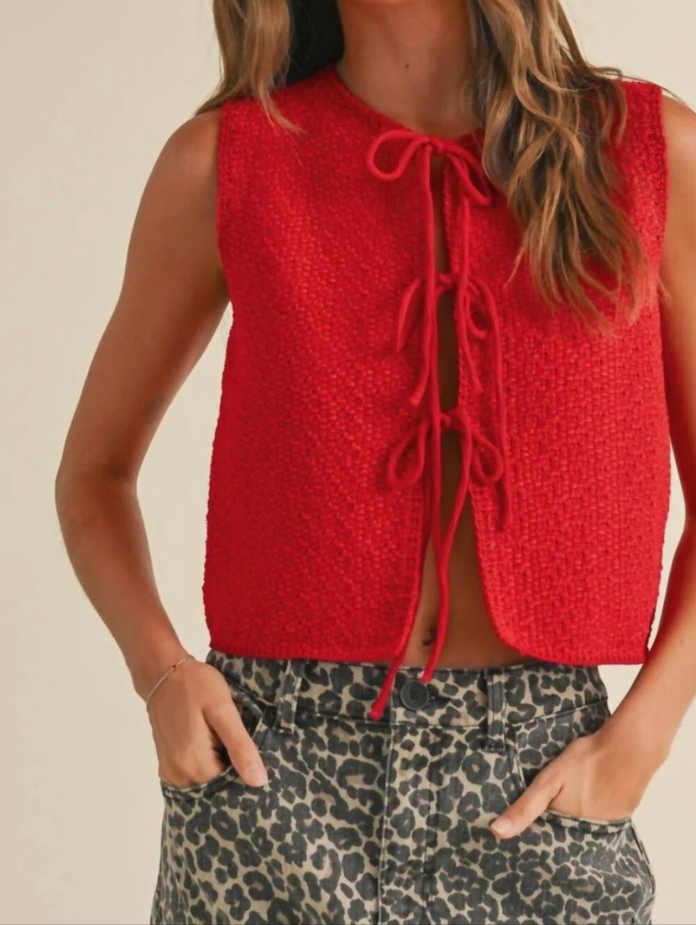 Miou Muse red chunky knit vest features a festive tie-front closure.